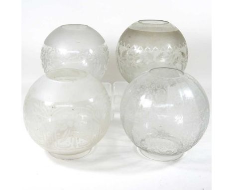A collection of four various etched glass oil lamp shades (4)