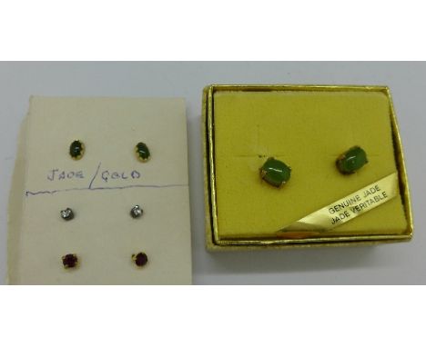 A pair of jade earrings and three other pairs of earrings