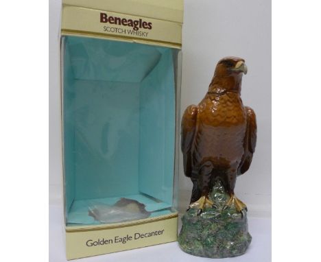 A Royal Doulton Beneagles Scotch Whisky golden eagle decanter with contents, boxed