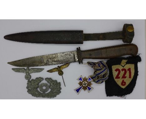 A German dagger marked Tiger, with scabbard, badges and a mothers cross medal 