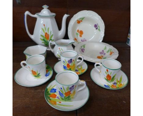 A Bristol Pountney four setting miniature tea service, four cups, saucers, teapot, sugar, cream and four Grindley floral deco