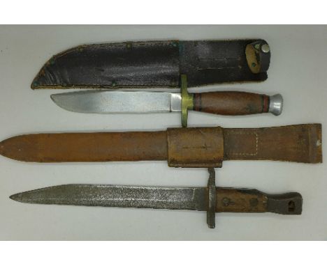 A bayonet with scabbard and a knife with sheath