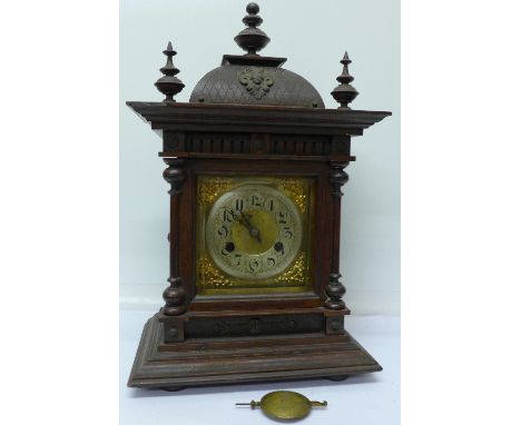 An oak mantel clock with chiming movement, 44cm