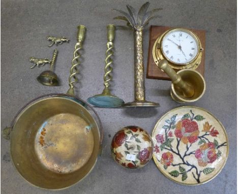 A pair of barleytwist brass candlesticks, a brass palm tree candlestick, a jam pan, clock, etc.