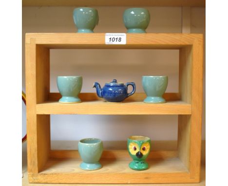 A Denby miniature teapot, electric blue; a set of five egg cups, green; another novelty egg cup, as an owl (7)