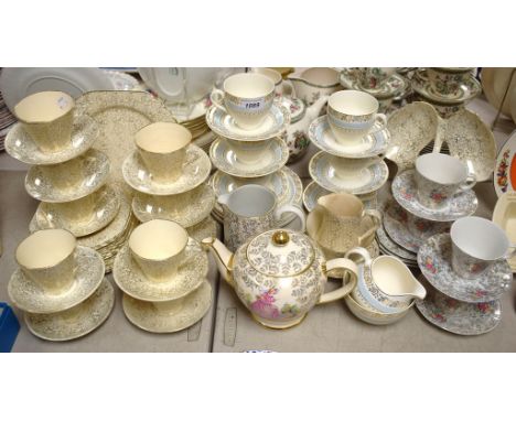 A Crinoline lady tea pot; a floral gilt tea service; others similar