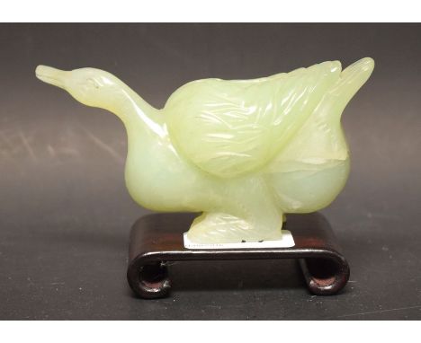A Chinese jade goose on hardwood stand