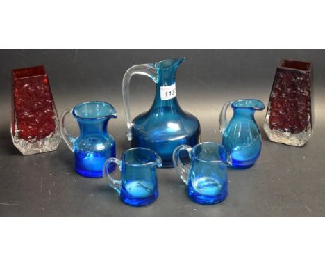 A pair of Whitfriars glass ruby red coffin vases, bark textured principle sides; a blue jug; others smaller (7)