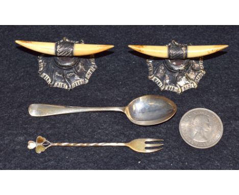 Silver - A pair of silver mounted bone knife rest; a spoon; a pickle fork; etc 