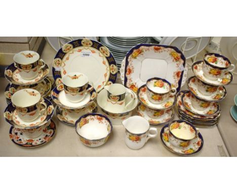 A Victorian Imari pallet tea service for six; another similar ( 2 )