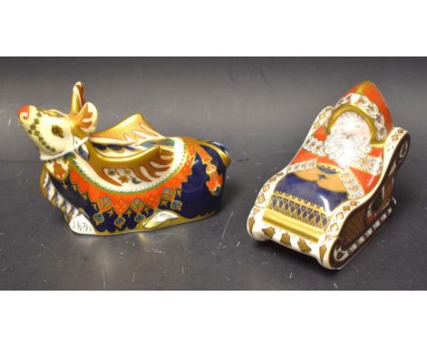 A Royal Crown Derby paperweight Santa and sleigh; another; Reindeer,silver stoppers (2)