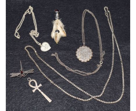 A silver locket on neckchain; brooches; etc.