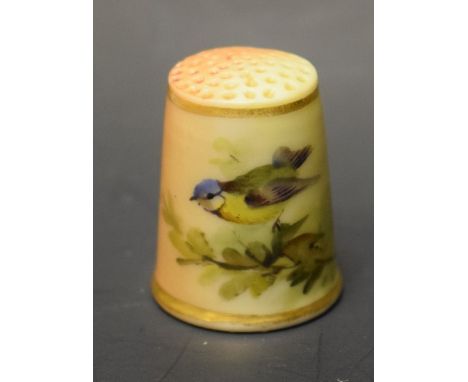 A Royal Worcester blush ivory thimble, painted with a bluetit resting upon branch, unmarked