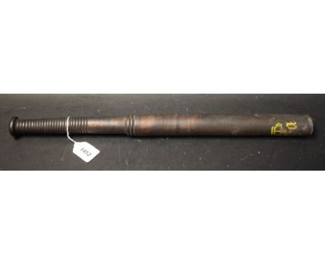 A Victorian tipstaff/truncheon, painted with the royal monogram surmounting a crown in yellow on a black ground, 53.5cm long,