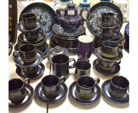 A Denby dinner and tea service, comprising dinner plates, salad plates, tea plates, tea pot, cream jug, sugar bowl, etc., qua