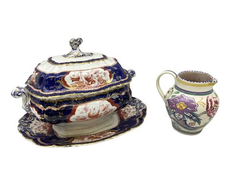 Early 20th century Poole jug, decorated with flowers in purple, blue and pink, with an upper geometric banded rim, no. 603, i
