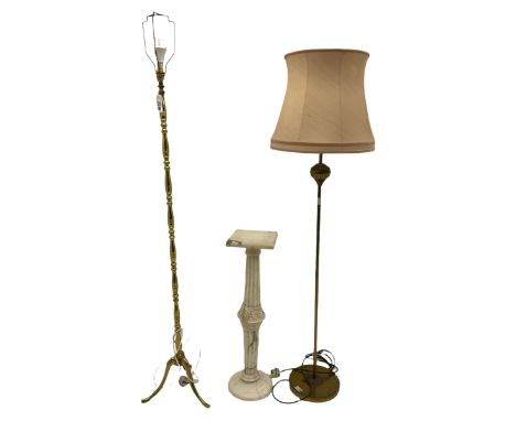 White marble pedestal stand (H80cm), early 20th century brass standard lamp with shade, and another brass standard lamp
