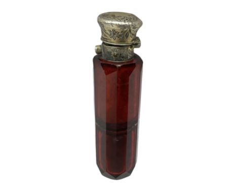 Victorian ruby cut glass scent bottle, with faceted sides, with ornately engraved silver plated cap, A/F, L10cm