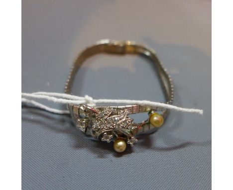 A Continental silver bracelet with cubic zirconia and faux pearl floral motif to centre