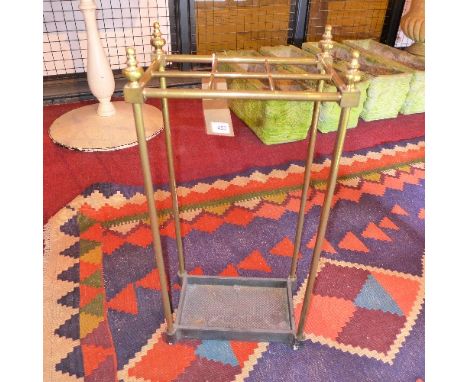 A 20th Century brass stick stand with cast iron base