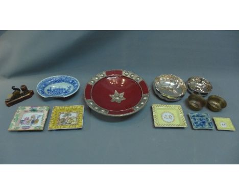 A miscellaneous collection of items to include a hand painted Indian ink well, ceramic ash trays, a pair of brass and copper 