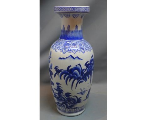 A 20h Century Chinese blue and white ceramic vase with floral decoration. H-61cm 