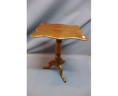 A walnut occasional table, the moulded top above turned support and tripod base, H. 68cm