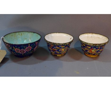 A pair of Chinese enamel bowls, decorated with dragons chasing a flaming pearl, together with another Chinese rice bowl, (3)
