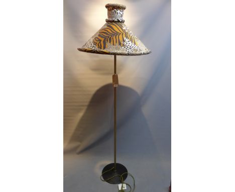 A floor standing lamp with faux leopard, tiger and zebra skin shade, H.180cm