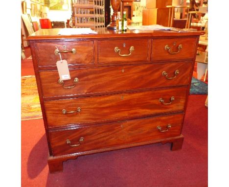 A Georgian style mahogany chest of three short over three long draws raised on carved bracket feet. H- 98cm W- 109cm D- 52cm 