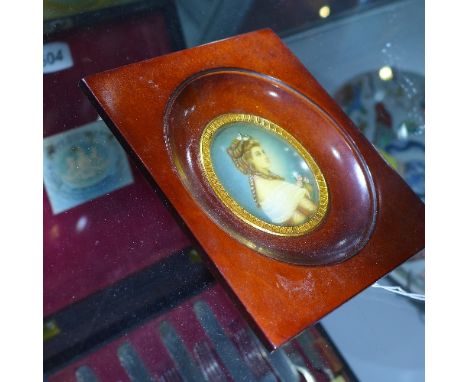 A miniature portrait of a lady holding pink flowers, in a rectangular mahogany frame, 6 x 5cm