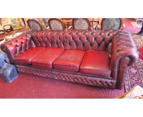 A 20th Century red leather Chesterfield four seater sofa