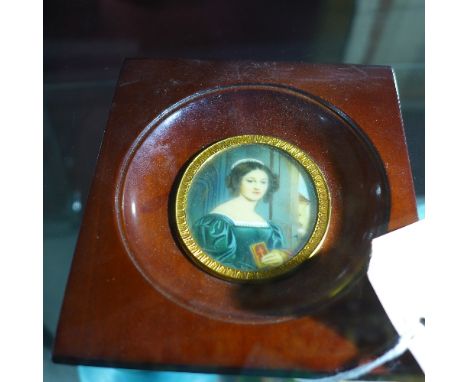 A miniature portrait of a lady deep in thought clutching a bible, in rectangular mahogany frame, 7 x 6cm