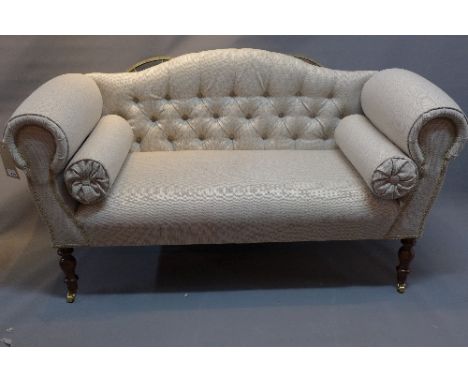 A Contemporary camel back sofa, having stone linen upholstery, raised on turned legs and castors, H. 69cm W. 138cm D. 55cm