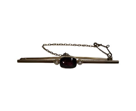A 15 carat gold seed pearl and amethyst bar brooch. CONDITION REPORT: 5.5g
