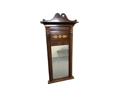 A 19th century mahogany hall mirror with pillar supports, height 105 cm