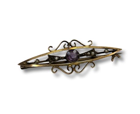 A 9 carat gold seed pearl and amethyst bar brooch. CONDITION REPORT: 2.9g
