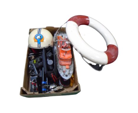 A box of Sky diving helmet, wooden life boat model, binoculars, camera tripod, life ring etc 