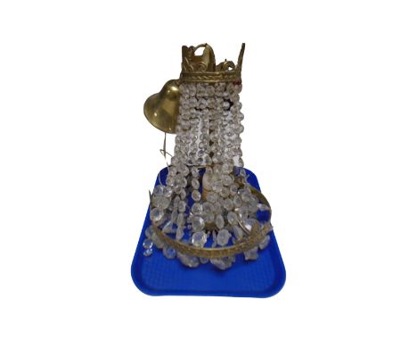 A continental brass light fitting with glass drops 