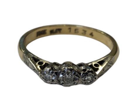 An 18ct gold and platinum three stone diamond ring, size N CONDITION REPORT: 2.6g