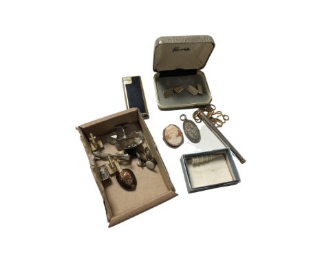 A collection of gent's cuff links, cameo brooch, flick lighter, pen on chain etc.