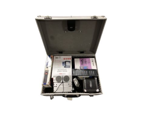 An aluminium case containing Black and Decker cordless screw driver,, mini amp, speaker, further crate of voltage indicators 