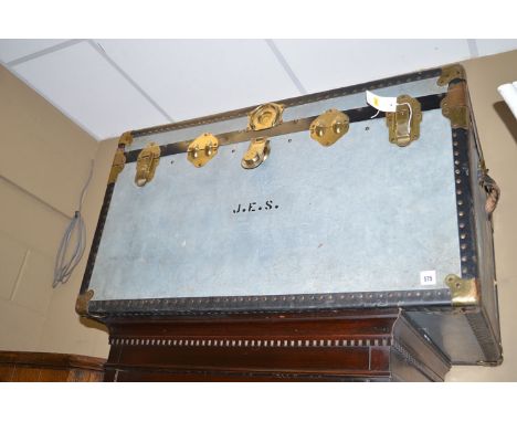 A large modern trunk with metal bindings.