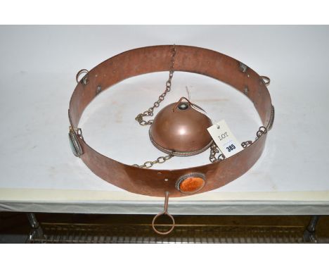An early 20th Century copper ceiling light fitting, the hammered ring fitted with five Ruskin ceramic buttons within ropework