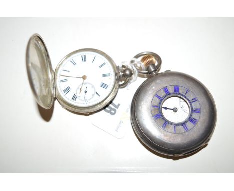 A silver cased half hunter pocket watch, the white enamel rim and dial with subsidiary seconds aperture covered by an outer c