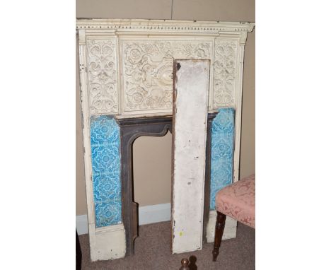 A Victorian cream painted cast iron fire surround with separate mantelpiece, fitted each side of the fire with four 6" blue p