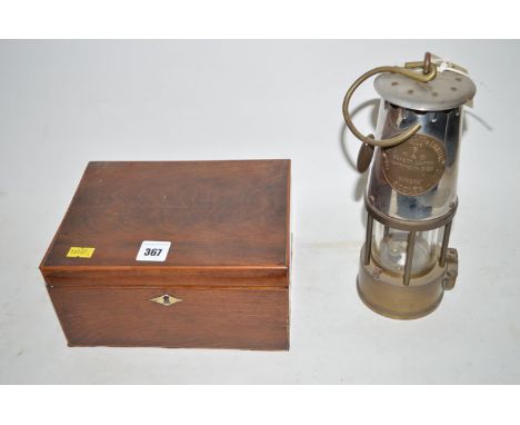 A 19th Century inlaid mahogany tea caddy containing sewing materials; and a Protector Lamp & Lighting Company Type 6 safety l