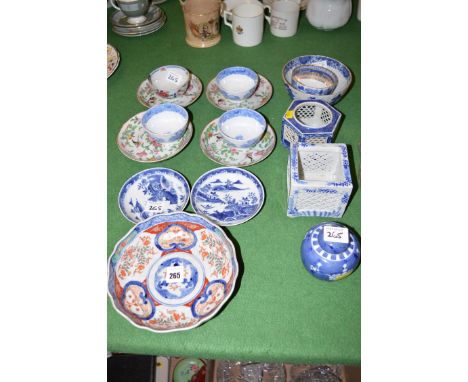 Two Oriental blue and white cricket boxers; and a selection of Oriental tea bowls; saucers; etc.
