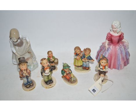 A collection of small Hummel figures; and two figurines.