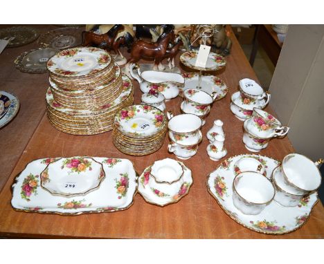 A Royal Albert 'Old Country Roses' tea and dinner service for twenty-eight place settings, including: cake stand, jug, condim
